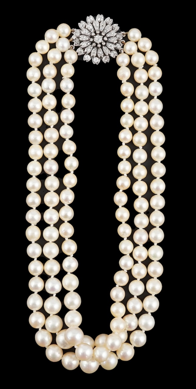 A triple strand graduated cultured pearl choker necklace, with old and rose cut diamond cluster set circular clasp